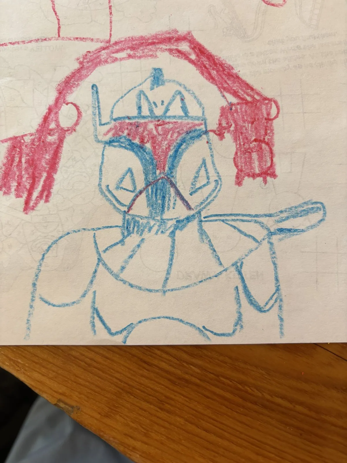 A colored crayon drawing depicting an armored character outline.